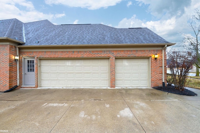 garage with concrete driveway