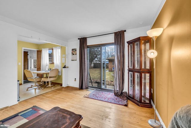 entryway with hardwood / wood-style floors and baseboards