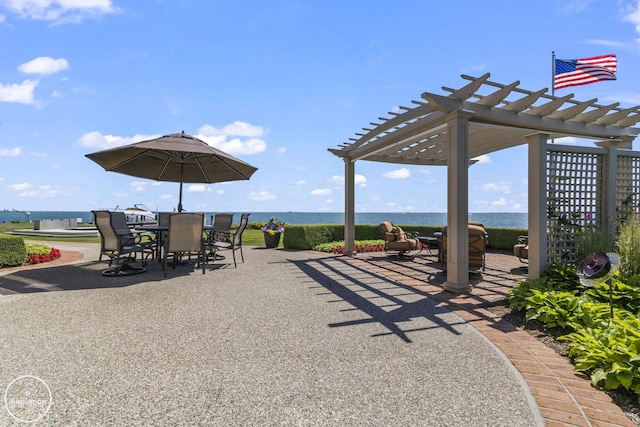 view of patio featuring outdoor dining area and a pergola