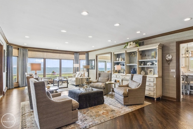 living room with recessed lighting, visible vents, dark wood-type flooring, ornamental molding, and wallpapered walls