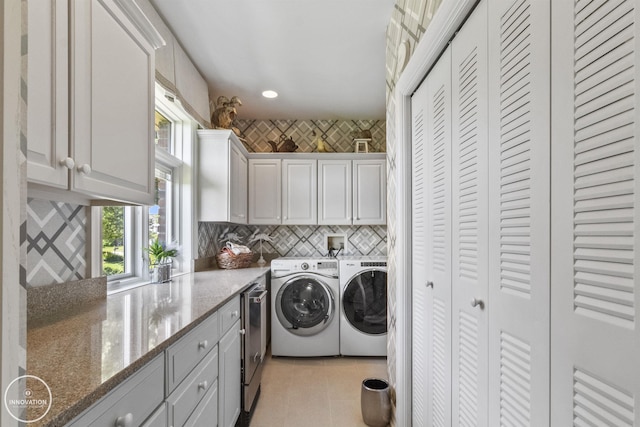 washroom with washing machine and dryer, cabinet space, recessed lighting, and light tile patterned floors