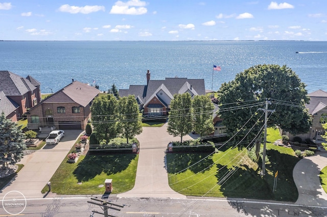 birds eye view of property featuring a water view