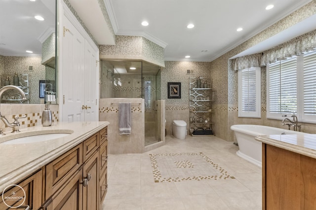 full bath featuring a stall shower, crown molding, tile walls, and vanity