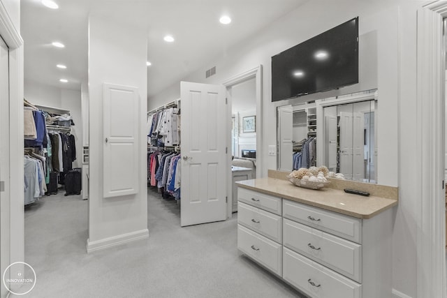 spacious closet featuring visible vents