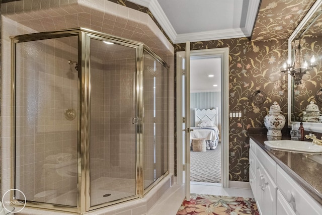 full bath featuring wallpapered walls, vanity, crown molding, and tiled shower