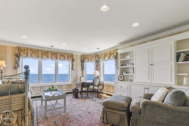 living area featuring recessed lighting, baseboard heating, crown molding, and wood finished floors