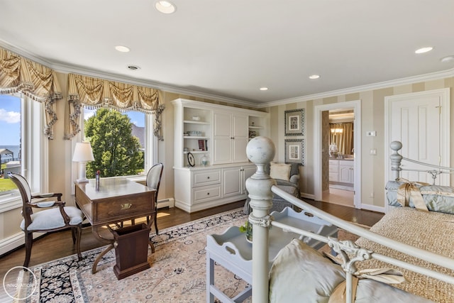 interior space with baseboards, ornamental molding, wood finished floors, a baseboard heating unit, and recessed lighting