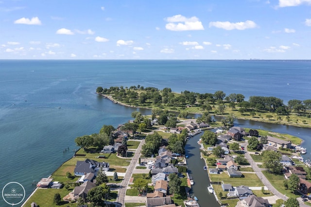 birds eye view of property featuring a water view and a residential view