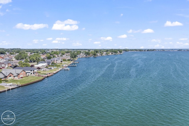 birds eye view of property featuring a water view and a residential view