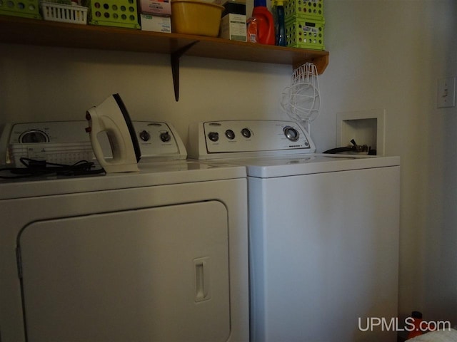 laundry room featuring laundry area and washing machine and clothes dryer