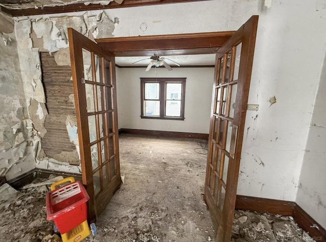 unfurnished room with ceiling fan, baseboards, and french doors