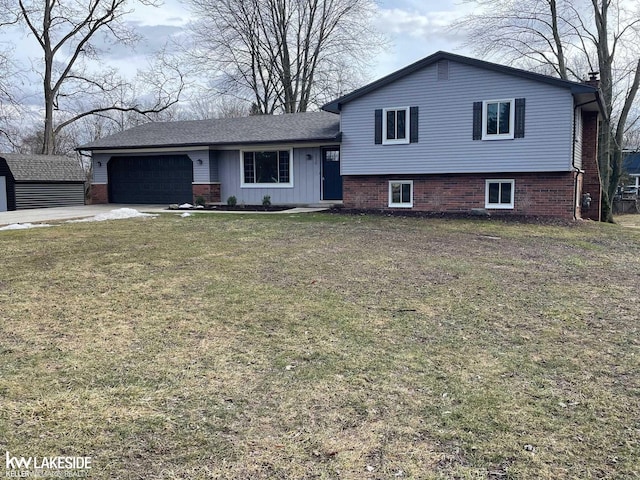 split level home featuring a garage, concrete driveway, brick siding, and a front lawn