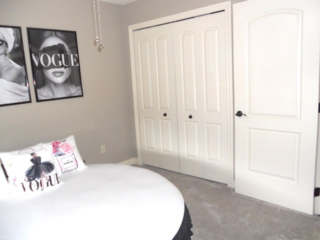 carpeted bedroom with a closet