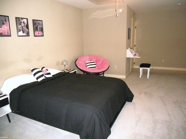 carpeted bedroom with baseboards