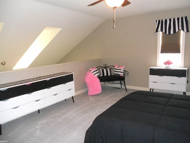 bedroom featuring a ceiling fan, baseboards, vaulted ceiling, and carpet flooring