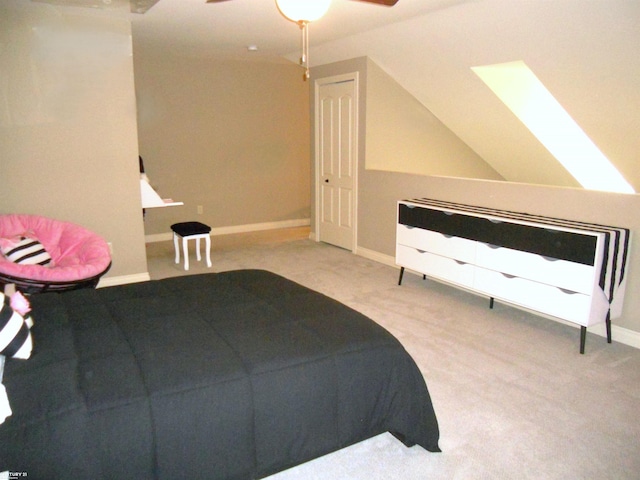 bedroom with lofted ceiling, ceiling fan, carpet flooring, and baseboards