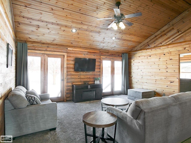 carpeted living room featuring wood ceiling, vaulted ceiling, log walls, and ceiling fan