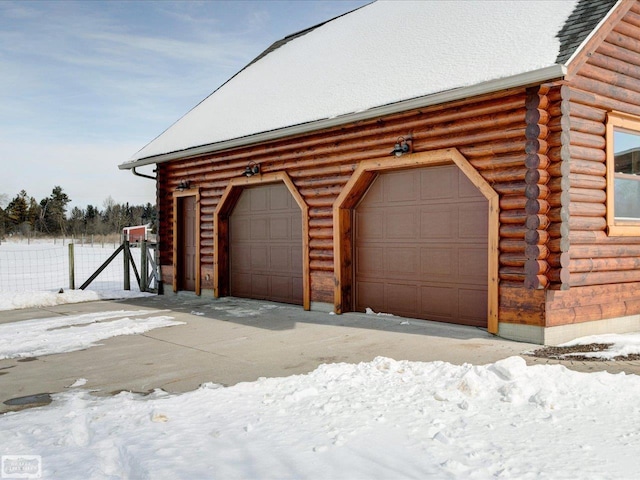 view of snow covered garage