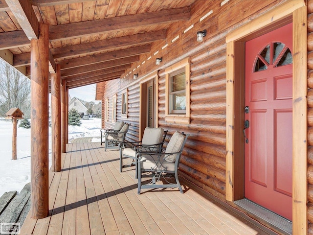 wooden terrace featuring covered porch