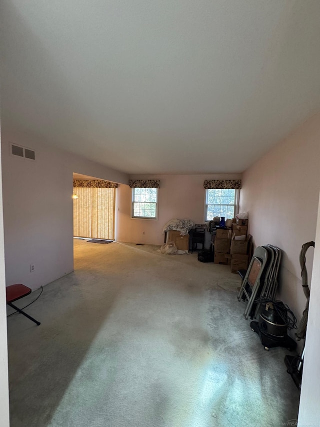 interior space featuring carpet and visible vents