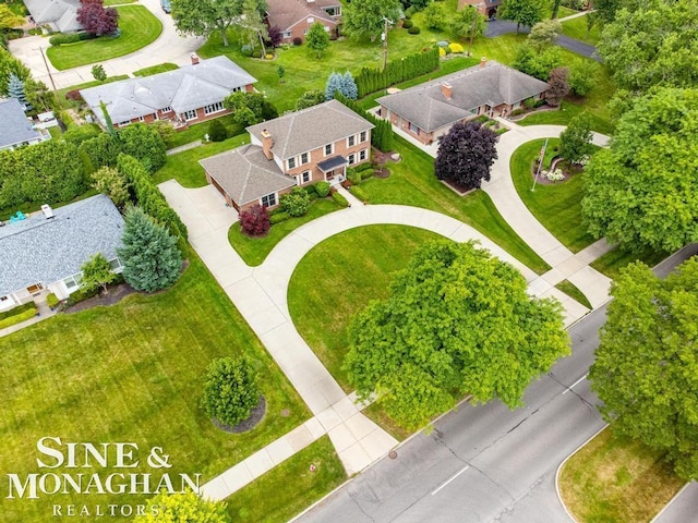 birds eye view of property with a residential view