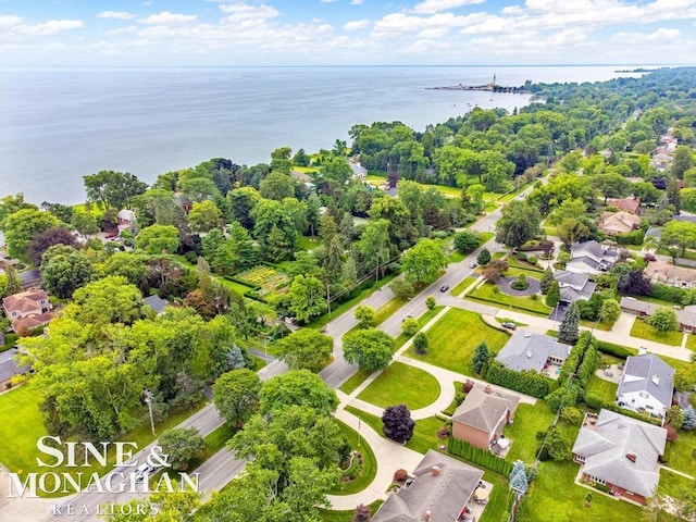 bird's eye view featuring a residential view and a water view