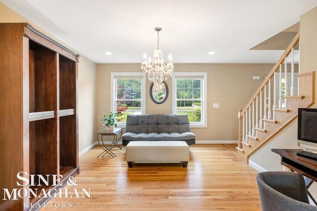 living area featuring baseboards, an inviting chandelier, stairs, light wood-style floors, and recessed lighting