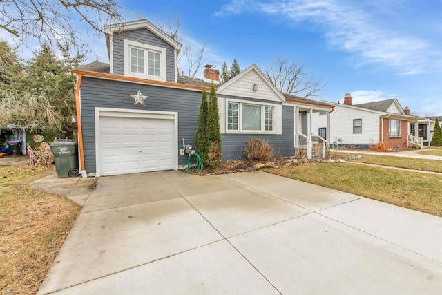 view of front facade featuring concrete driveway and a front yard