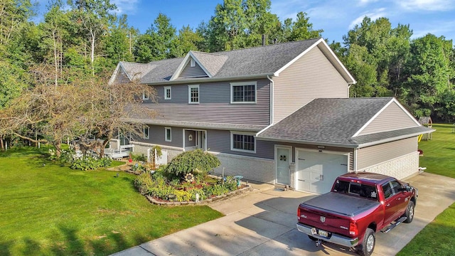 view of front of home featuring a garage, a front yard, driveway, and a shingled roof