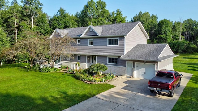 view of front of property with a garage, roof with shingles, concrete driveway, and a front yard