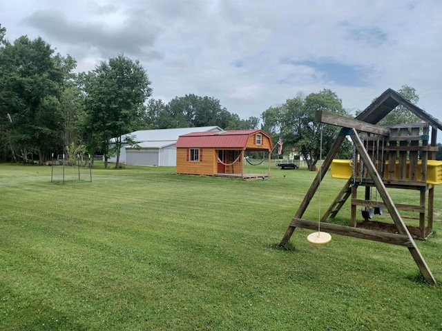 view of play area with an outbuilding and a yard