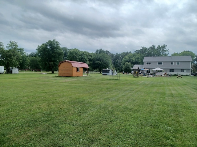 view of yard with a storage shed and an outdoor structure