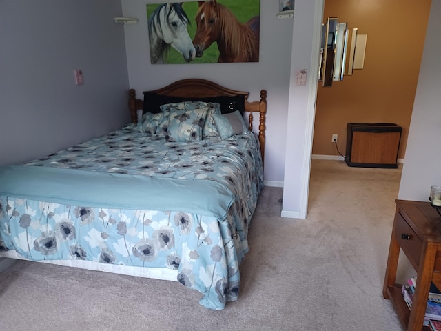 carpeted bedroom with baseboards