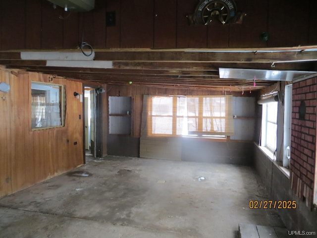 garage featuring wooden walls