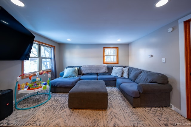 living area with recessed lighting and baseboards