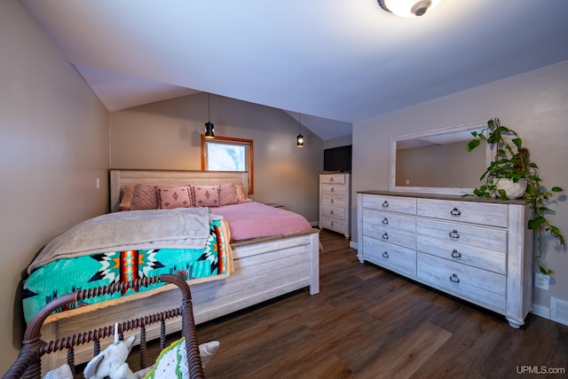 bedroom featuring vaulted ceiling, dark wood-style flooring, and visible vents