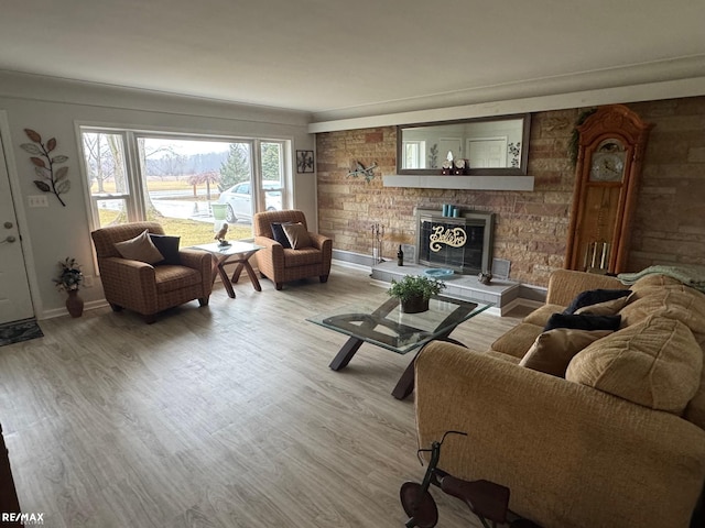 living area with baseboards and light wood finished floors