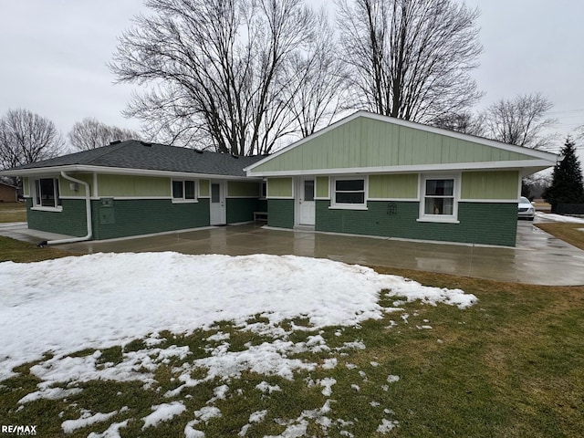 ranch-style house with brick siding