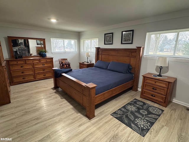 bedroom with light wood-type flooring