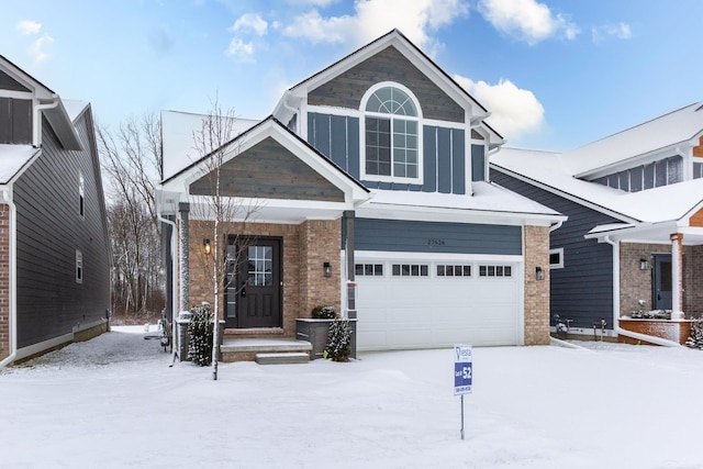 view of front of home featuring board and batten siding and brick siding