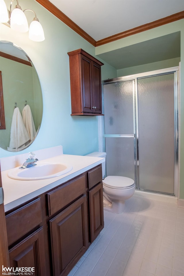 full bathroom featuring toilet, a stall shower, vanity, and crown molding