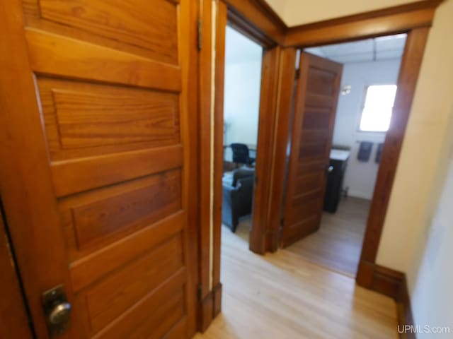 corridor featuring light wood-style flooring