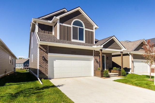 view of front of house featuring a garage, brick siding, concrete driveway, a front lawn, and board and batten siding