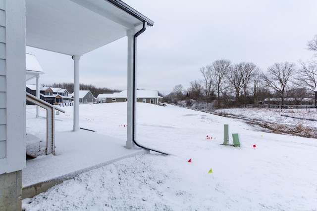 view of yard covered in snow