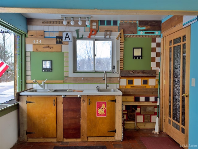 kitchen with light countertops and a sink