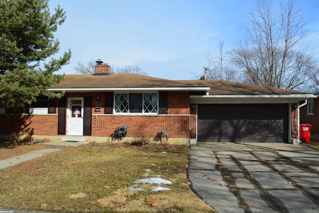 ranch-style home with a garage, concrete driveway, brick siding, and a chimney