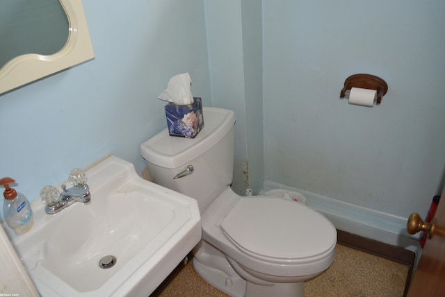 half bath with a sink and toilet