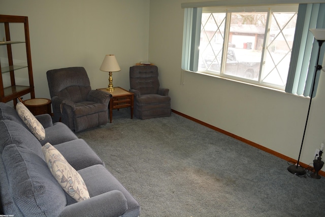 living room featuring baseboards and carpet flooring