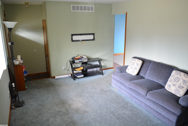 living room with baseboards, visible vents, and carpet flooring