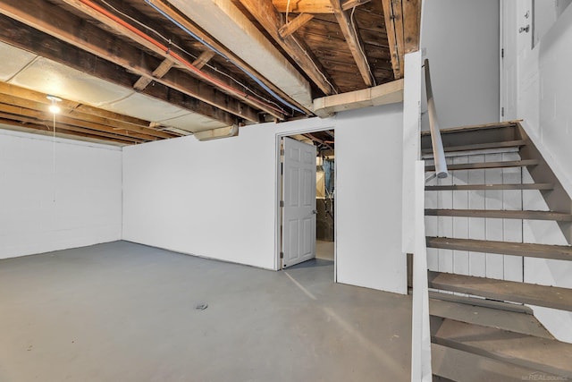 unfinished basement with stairs